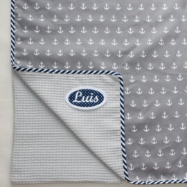 Light baby blanket , Cotton Fabric ” anchors on a gray background